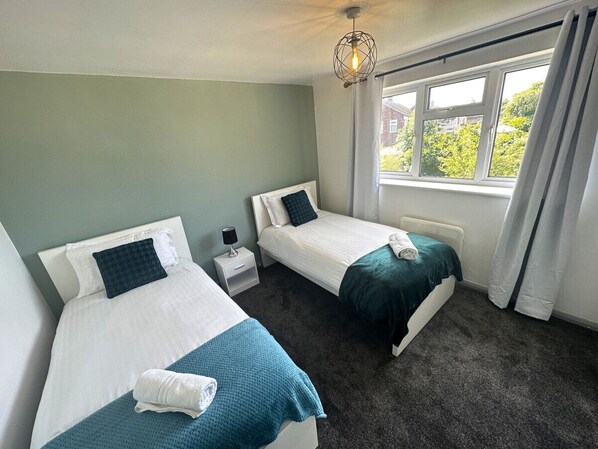 Bedroom 1 - 2 single beds, Study desk, wardrobe, amazing garden view