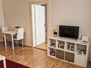 Furniture, Property, Table, Interior Design, Wood, Living Room, Flooring, Building, Television, Comfort