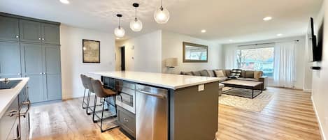 Main floor open concept kitchen and living room area