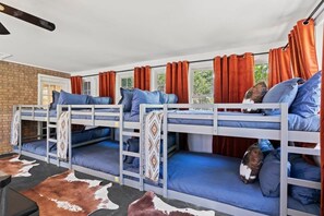 Bedroom 6 featuring 6 queen beds (3 bunks) & Indoor games. Perfect Kids area!
