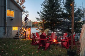 Fire Pit with Brand new Muskoka Chairs, Fire Pit and String Lights. 
