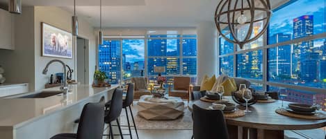 Large luxurious corner unit, offering a bright and open main living space/kitchen - perfect for entertaining! Enjoy the breathtaking downtown skyline and the Calgary Tower views from every angle!