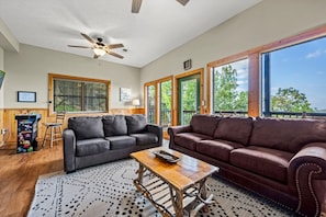 The game room downstairs includes two sofas. Each includes a pull out Queen bed that provides additional sleeping for up to 4 people.