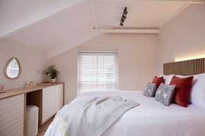 The sumptuous double bedroom is west facing with views of the castle.