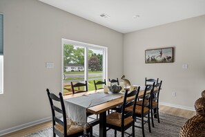 Dining area with table seating for 6 and backyard access