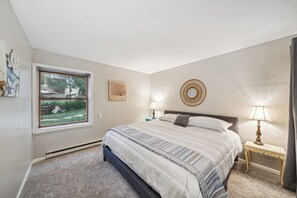 Enjoy this comfortable king-sized bed in the lower apartment.