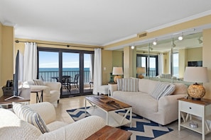 The ocean front living room is well-appointed with comfortable furnishings.