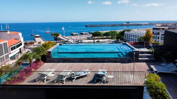 Infinity pool offers breathtaking views of Funchal cityscape and the sparkling ocean beyond. #savoyinsular #urbanretreat #oceanview #pool