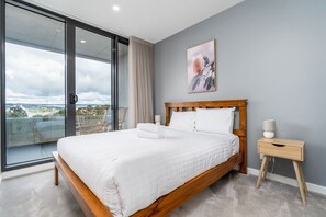 Bedroom 1 offers a restful retreat with a queen-size bed adorned with professionally laundered linens. Enjoy the convenience of an ensuite bathroom, ensuring privacy and comfort during your stay.