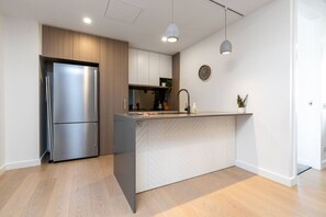 Prepare delicious meals in our fully-equipped kitchen, stocked with everything you need. From modern appliances to ample cookware and utensils, this kitchen has it all for your culinary adventures.