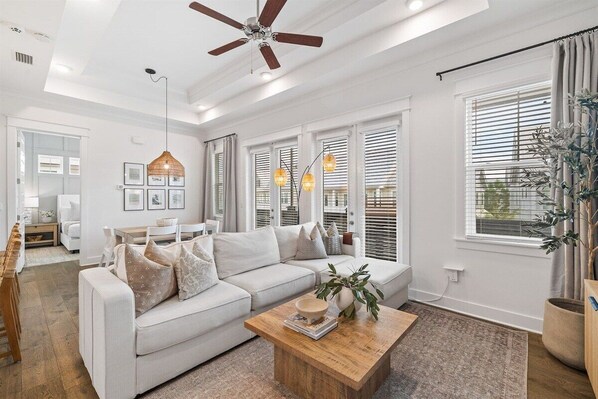 Let the bright open living room of "Home Away" take you away...