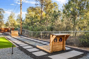 Horse Shoes, Anyone?  Challenge friends and family to a game of horseshoes in this fun and spacious backyard area.