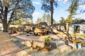 Unwind in the soothing hot tub, the perfect spot to relax and rejuvenate under the open sky.