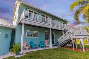 Our front porch with colorful chairs.