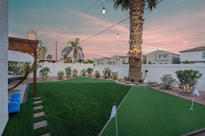 Evening ambiance with lights, garden, BBQ, mini golf and backyard activities