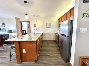 "Indoors","Floor","Kitchen","Refrigerator","Flooring"