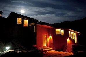 Full Moon night in front of Casita showing sunken patio area.