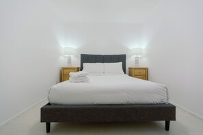 Guest bedroom 1 - Brand new Queen mattress, featuring four pillows & crisp linen