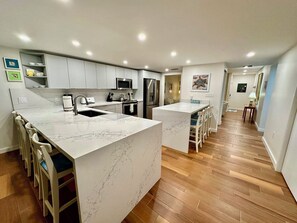 The fully-equipped kitchen seats 7.