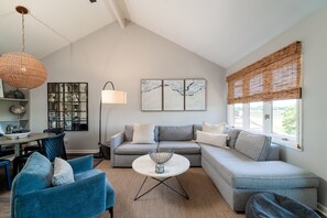 The great room has vaulted ceilings which lends to the spaciousness of this room