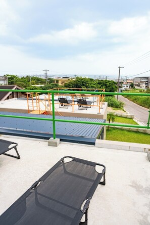 Rooftop sunbeds, ocean views, and starry skies at night