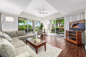 Spacious living room with views of wrap around porch