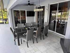 Outdoor dining area with seating for eight, perfect for alfresco meals.
