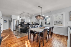 Kitchen and Dining Room: Fully equipped kitchen, 6-person dining table, open layout with kitchen and living room