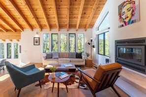 The living room features a fireplace.