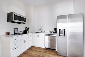 Fully equipped commercial kitchen with high quality granite countertops. 