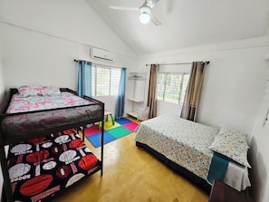 Twin bunkbed, Full-size bed, AC, ceiling fan, closet and kids play area