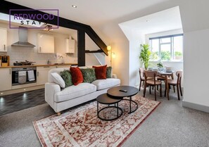 LIVING ROOM, DINING AND KITCHEN SHOT