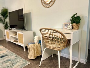 A small desk provides a dedicated work space.