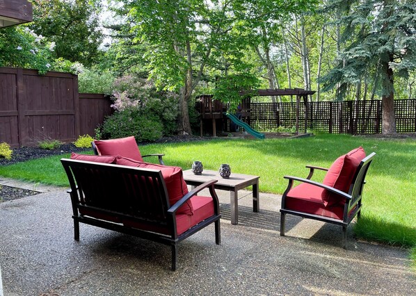 Large backyard with a play structure