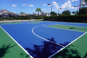-A large, open area designed for outdoor games and activities, perfect for all ages. -Equipped with outdoor lighting for evening games and extended fun.