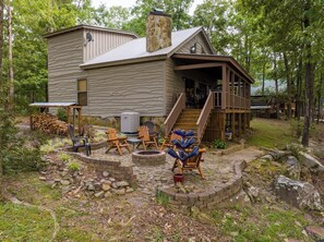 Fire Pit in the side yard of A Bear's Lair. 
Wood Burning Fire Pit with Complimentary Firewood.