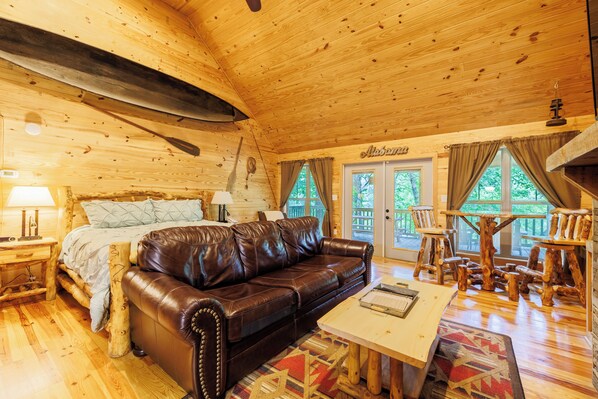 Cozy couch facing the indoor fireplace.