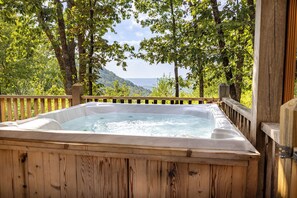 Private hot tub overlooking the valley and mountain views. 