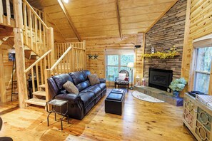 Enjoy Mossy Rock Retreat's open and spacious living room with gas fireplace. 