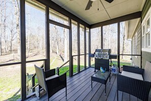 Cozy Screened-In back porch with grill.