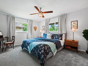 Rest easy in our serene bedroom, featuring a plush bed and soothing decor for a perfect night’s sleep.