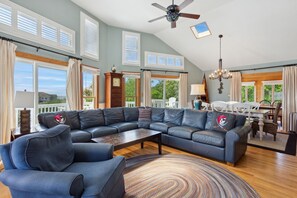 Relax in the spacious Living Area with lots of natural light and plenty of cozy furniture.
