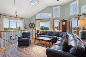 Relax in the spacious Living Area with lots of natural light and plenty of cozy furniture.