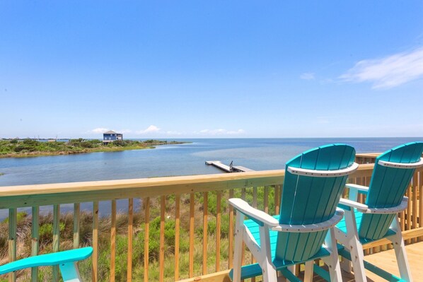 Step right out onto your private deck and enjoy beautiful sunsets over the sound as you relax with cozy cocktail seating.