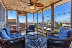 Enjoy the warmth of the OBX sunshine in the comfort of your Screened-In Porch.