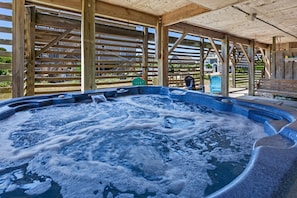 Relax in the bubbly Hot Tub after a day at the beach.