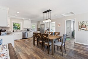 The nearby dining area is perfect for a meal as a family.