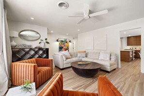 Stylish second living room, perfect for cocktails, games, and lively conversation. This inviting space is designed for entertainment and relaxation, featuring cozy seating and a vibrant atmosphere. Ideal for hosting gatherings or enjoying quiet eveni