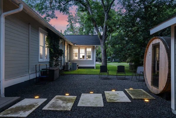 Well-maintained backyard with a variety of trees and shrubs for a natural, private setting!