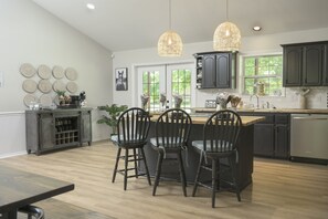 Enjoy the open-concept kitchen in the main house, perfect for cooking and entertaining.